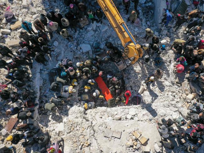 An aerial picture shows rescuers searching the rubble of buildings for casualties and survivors in the village of Salqin in Syria's rebel-held northwestern Idlib province. Picture: AFP