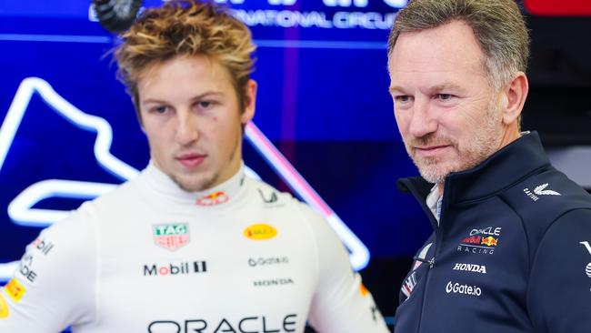 BAHRAIN, BAHRAIN - FEBRUARY 26: Christian Horner, Team Principal of Oracle Red Bull Racing and Liam Lawson of New Zealand and Oracle Red Bull Racing look on in the garage during day one of F1 Testing at Bahrain International Circuit on February 26, 2025 in Bahrain, Bahrain. (Photo by Mark Thompson/Getty Images)