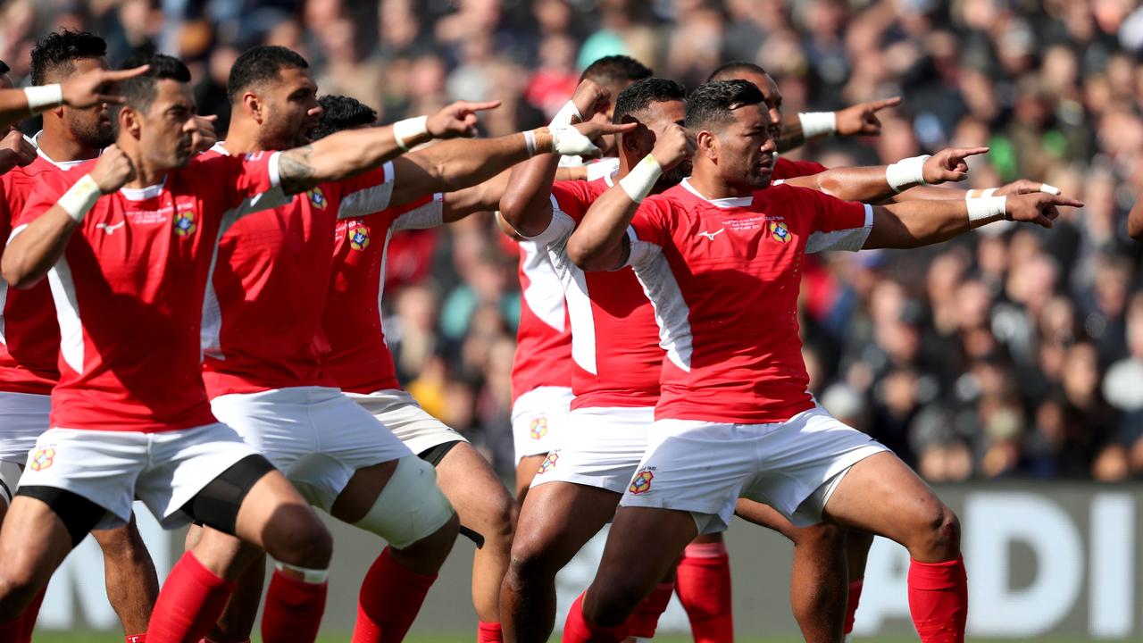 Tonga players perform the Sipi Tau against New Zealand in Hamilton.
