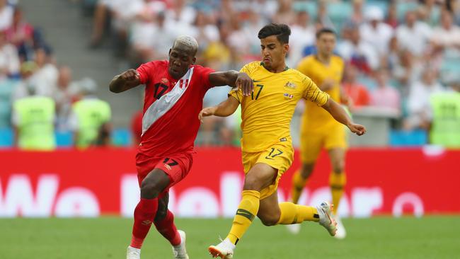 Peru’s Luis Advincula and Socceroo Daniel Arzani compete for the ball during the 2018 FIFA World Cup Russia Group C match at Fisht Stadium. (Photo by Dean Mouhtaropoulos/Getty Images)