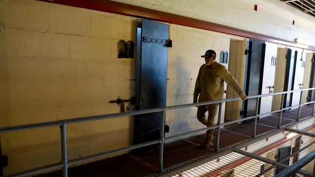 Site Officer Peter Brown inspects the upper levels of Wing 6 for anything out of place at the Old Parramatta Gaol in North Parramatta. Picture: Angelo Velardo