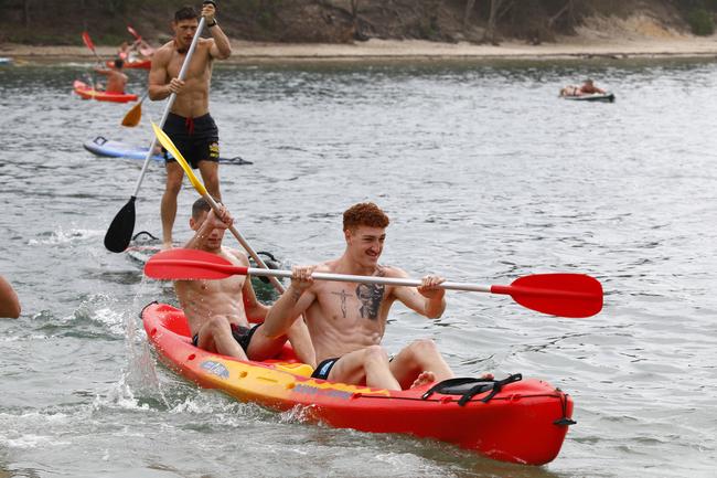 Gold Coast Suns player Matt Conroy leads his canoe team during training at Palm Beach. Picture: Tertius Pickard