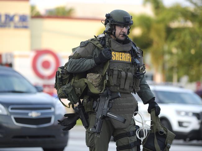 A SWAT member arrives to the scene of a fatal shooting at Pulse Orlando nightclub in Orlando. Picture: Phelan M Ebenhack