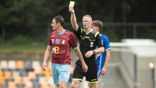 APIA’s Josh Symons booked after a foul on Olympic player Darcy Burgess Picture: Julian Andrews