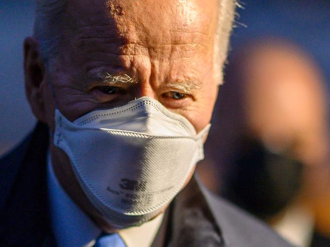 US President Joe Biden leaves the White House to spend the weekend in Camp David, on February 12, 2021 in Washington DC. (Photo by Eric BARADAT / AFP)