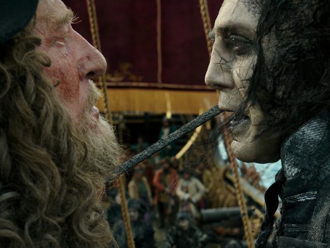 Captain Barbossa (Geoffrey Rush) can smell the foul breath of the villainous Captain Salazar (Javier Bardem).