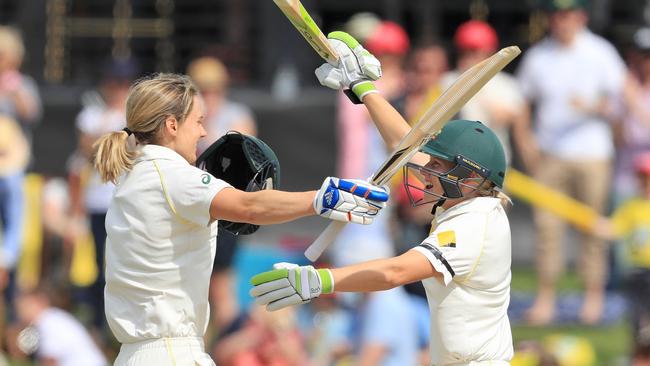 Ellyse Perry celebrates her century with Alyssa Healy during day three of the Women's Test match between Australia and England on November 11, 2017. (Pic: Getty)