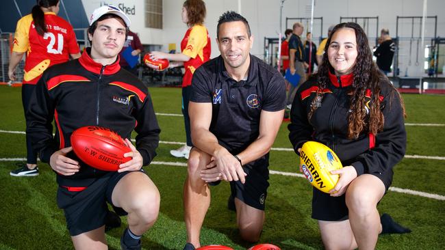 McLeod with Keynan Harradine (Murray Bridge) and Keleia West (Avenues School) at West Lakes in 2018 after it was announced that the Crows would partner the South Australian Aboriginal Sports Training Academy and run a program led by McLeod for students.