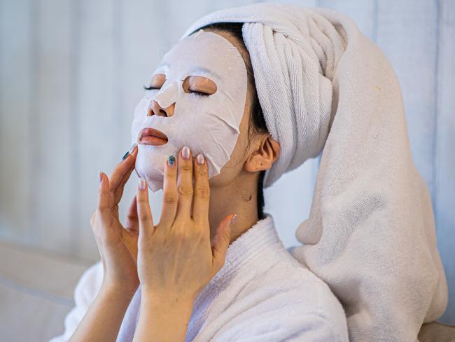 Woman with purifying mask on her face