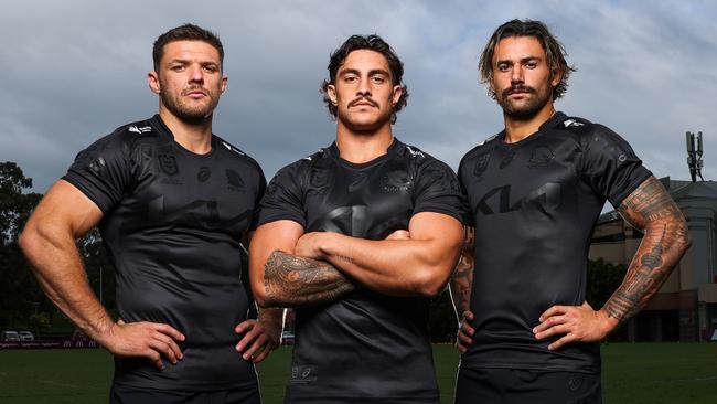 Broncos players Corey Jensen, Kotoni Staggs and Jesse Arthars in the Broncos’ all-black jersey, created to tackle the ‘Black Dog’ of depression and break the silence on asking for mental health help. Picture: NRL