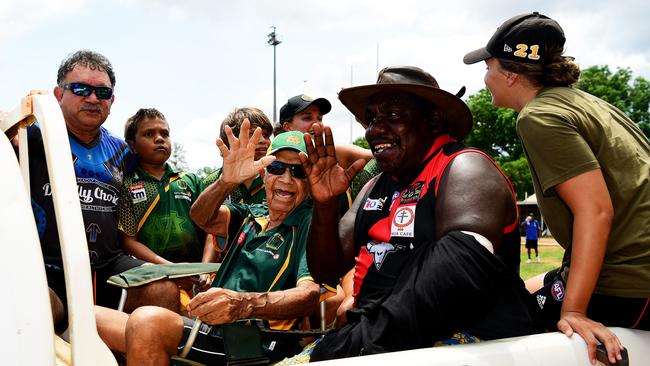 St.Mary's legend Jack Long Sr with friends and family as he does a victory lap around the Tiwi oval on Bathurst Island last year. Picture: Justin Kennedy