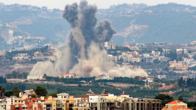 This picture taken from the southern city of Tyre shows smoke billowing from the site of an Israeli airstrike that targeted the southern Lebanese village of Rmadiyeh, on October 7, 2024. The Israeli army said on October 7 that it had deployed another division to participate in operations in Lebanon -- making it the third troop grouping at division strength to be used in the ground fight against Hezbollah. (Photo by KAWNAT HAJU / AFP)