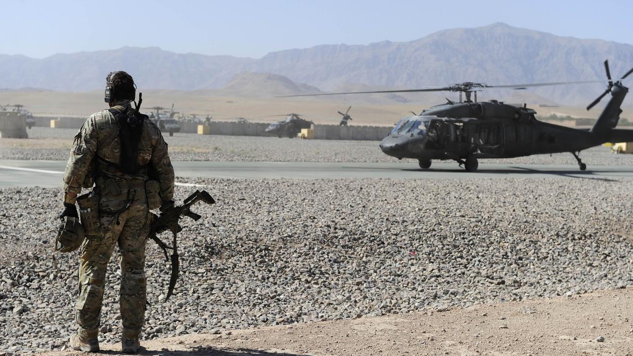 An Australian Special Operations Task Group Soldier waits to move towards a UH-60 Blackhawk helicopter as part of the Shah Wali Kot Offensive against the Taliban. Picture: Corporal Raymond Vance