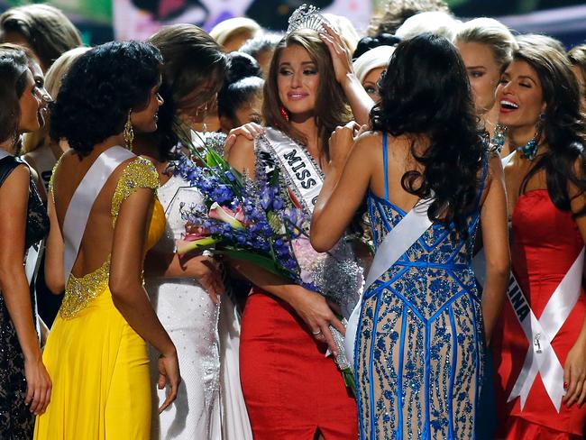 Victorious ... Miss Nevada Nia Sanchez celebrates with her competitors after being crowned Miss USA 2014. Picture: Jonathan Bachman