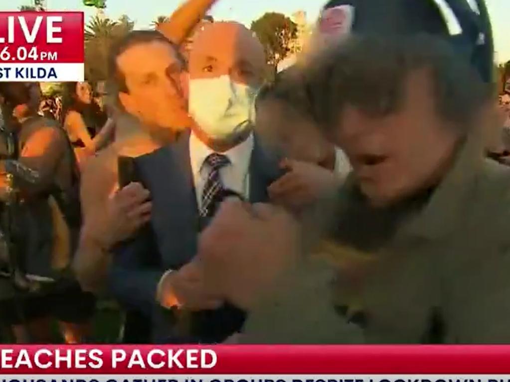 Reporter Paul Dosley was grabbed by a stranger and kissed as the reporter did a live cross.