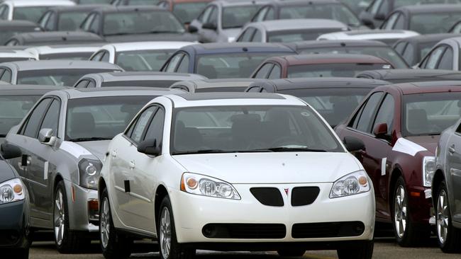 FILE - This March 16, 2006 file photo shows a Pontiac G6 shown outside the General Motors Orion Assembly plant in Orion Township, Mich. General Motors is recalling 2.4 million vehicles in the U.S., including Pontiac G6's from the 2005-2008 model years, as part of a broader effort to resolve outstanding safety issues more quickly. (AP Photo/Paul Sancya, File)