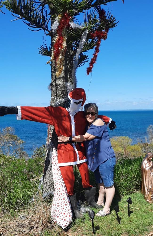 Leann Massey with a Santa statue: Point Vernon 2023 - Fraser Coast.