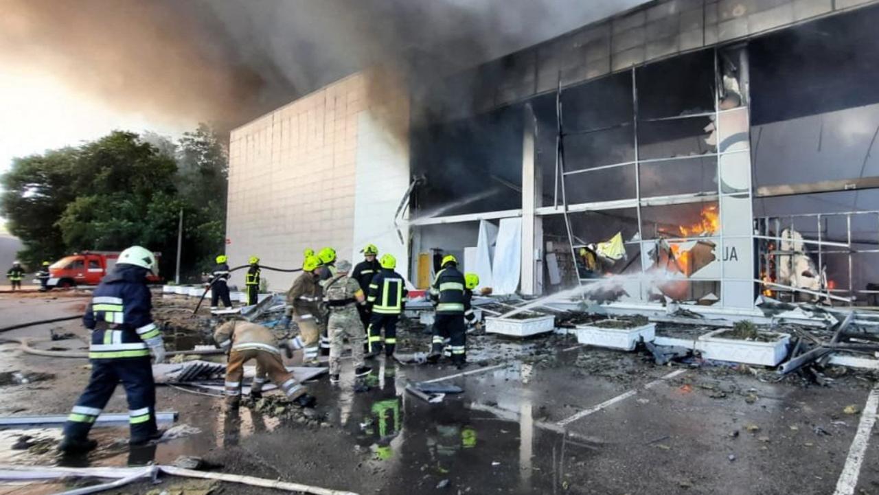 Firefighters put out the fire in a mall hit by a Russian missile strike in the eastern Ukrainian city of Kremenchuk. Picture: AFP