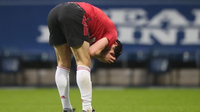 Manchester United defender Harry Maguire reacts at the end of the English Premier League football match between West Bromwich Albion and Manchester United. (Photo by Nick Potts / POOL / AFP)