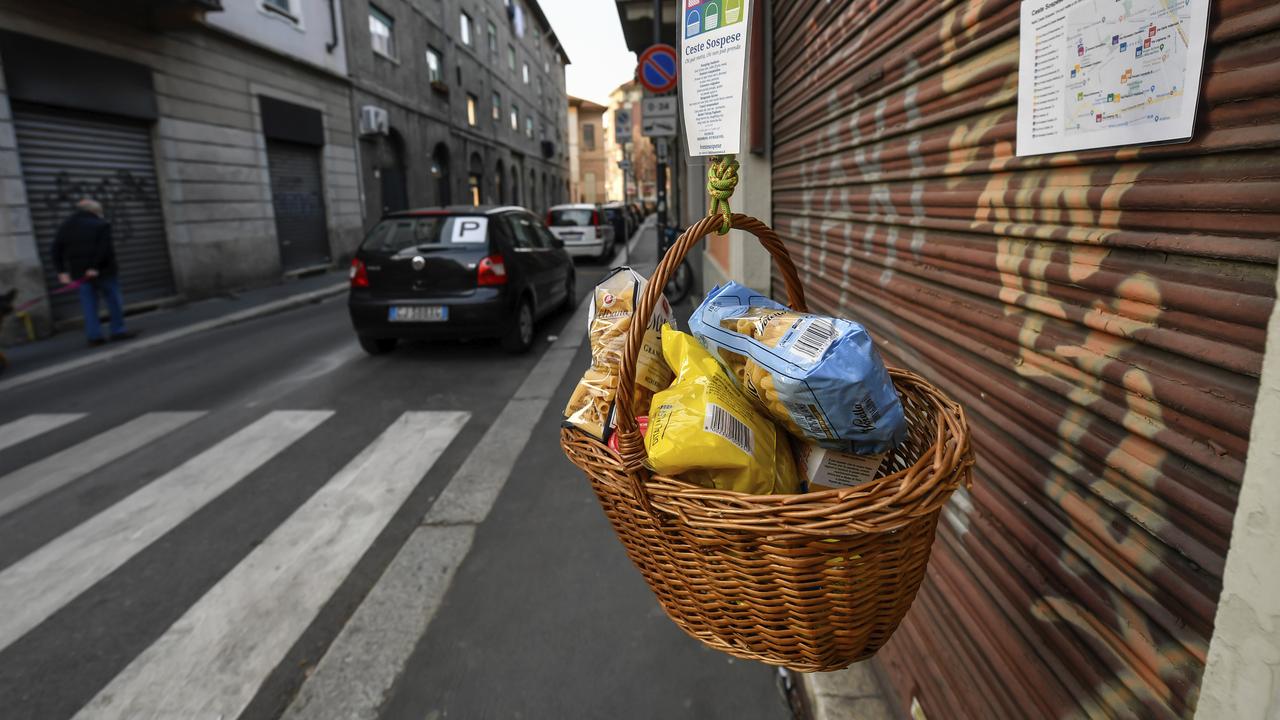 A hanging basket with food is left for the needy in Milan, Italy. Picture: Claudio Furlan/LaPresse via AP