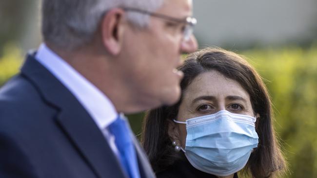 Scott Morrison and NSW Premier Gladys Berejiklian at the Covid financial relief announcement on Tuesday. Picture: Getty Images