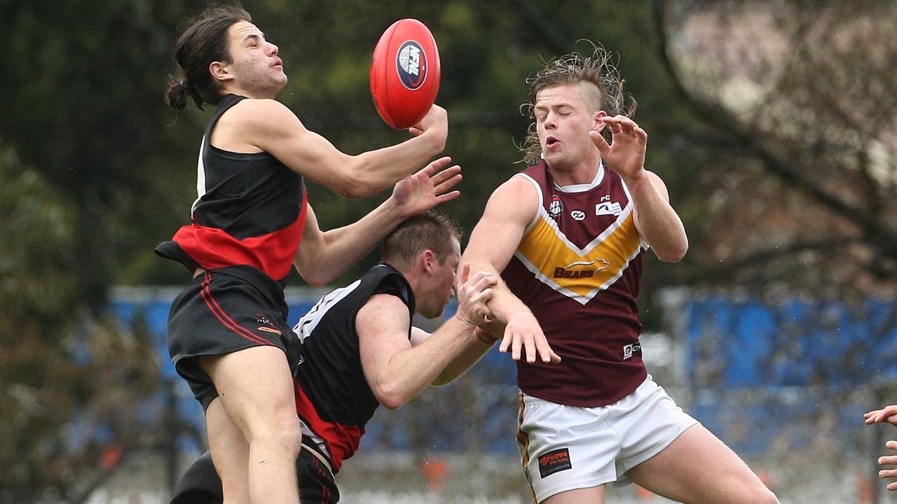 Lane Sinclair flies for a mark for Eltham. Picture: Hamish Blair