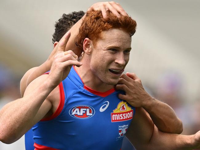 MELBOURNE, AUSTRALIA - FEBRUARY 15: Ed Richards of the Bulldogs celebrates kicking a goal during the 2025 AFL Pre-Season match between Western Bulldogs and Essendon Bombers at Whitten Oval on February 15, 2025 in Melbourne, Australia. (Photo by Quinn Rooney/Getty Images)