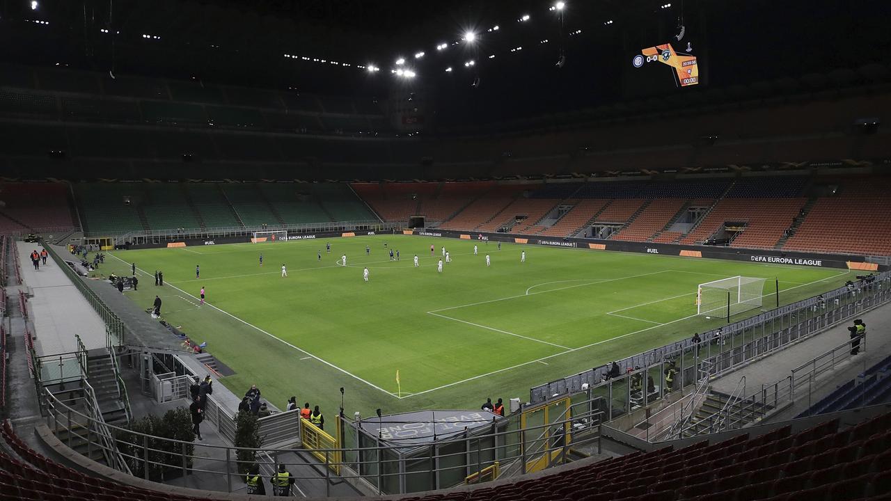 The seats are empty as a precaution against the coronavirus at the San Siro stadium in Milan, Italy, during the Europa League round of 32. (Emilio Andreoli, UEFA via AP, File)