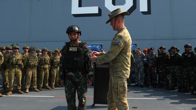 A ceremonial patch sharing ceremony between Australian Defence Force and Indonesian National Armed Forces aboard the HMAS Adelaide in Darwin ahead of Exercise Keris Woomera on November 3. Picture: Zizi Averill