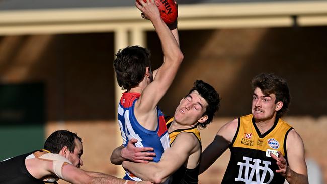 WRFL: Point Cook’s Max Rouvray gets tackled. Picture: Andy Brownbill