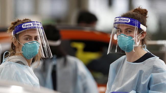 Medical staff perform Covid-19 testing at a drive-through testing site in South Melbourne. Picture: Darrian Traynor/Getty Images