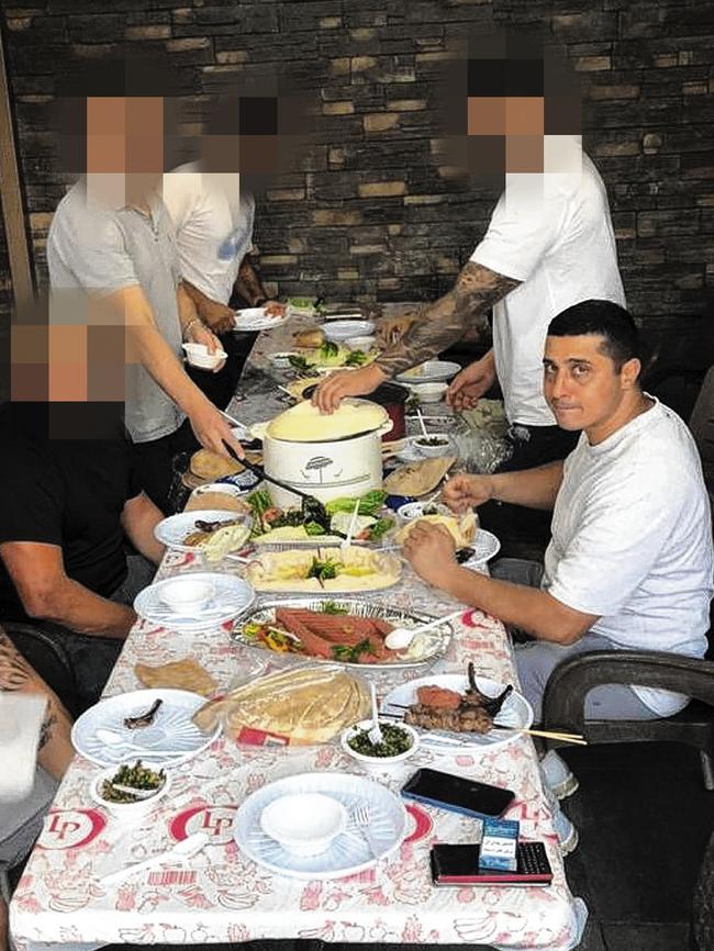 Haouchar enjoying a meal with friends in Lebanon before his arrest last year.