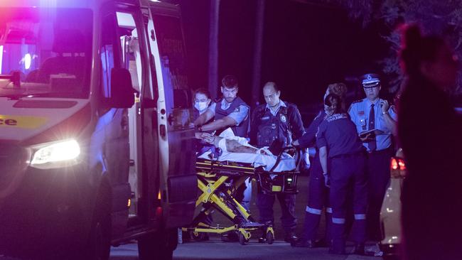 The 19-year-old is rushed to hospital. Picture: Gordon McComiskie