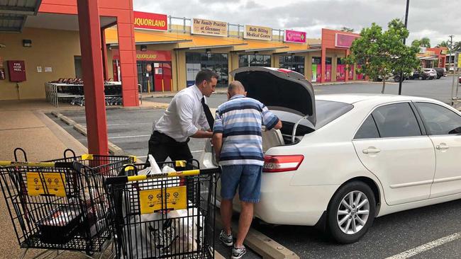 Manager Scott Perel helps Mr Davies load his Grocery Grab loot. Picture: contributed