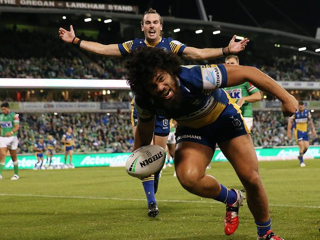 CANBERRA, AUSTRALIA - APRIL 17:  Isaiah Papali'i of the Eels celebrates with team mates after scoring a try during the round six NRL match between the Canberra Raiders and the Parramatta Eels at GIO Stadium on April 17, 2021, in Canberra, Australia. (Photo by Matt Blyth/Getty Images)