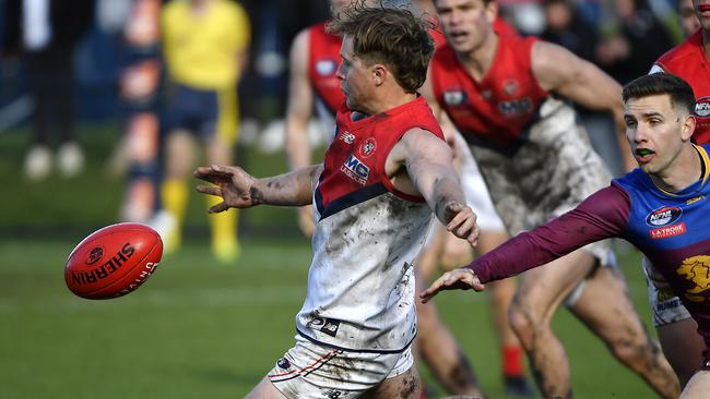 Tyler Barnes gets a kick for Diamond Creek. Picture: Andrew Batsch