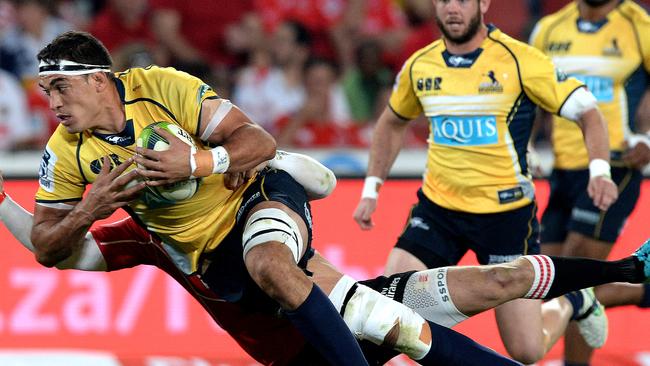 Rory Arnold of the Brumbies is tackled during the Super Rugby match against the Lions.