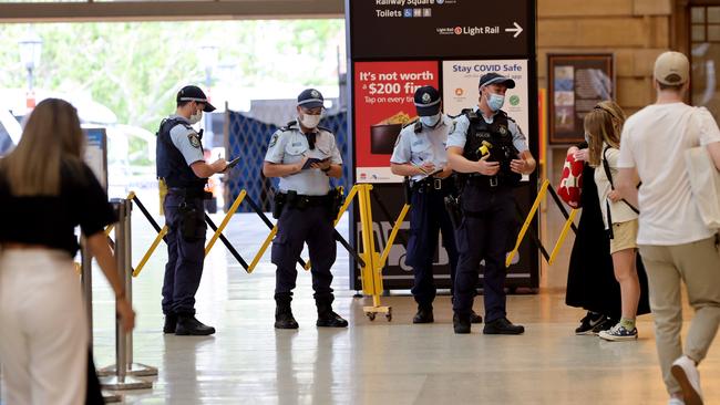 Police pictured in front of a crime scene at Central station where a man was stabbed then taken to hospital in a serious condition. Picture: Damian Shaw