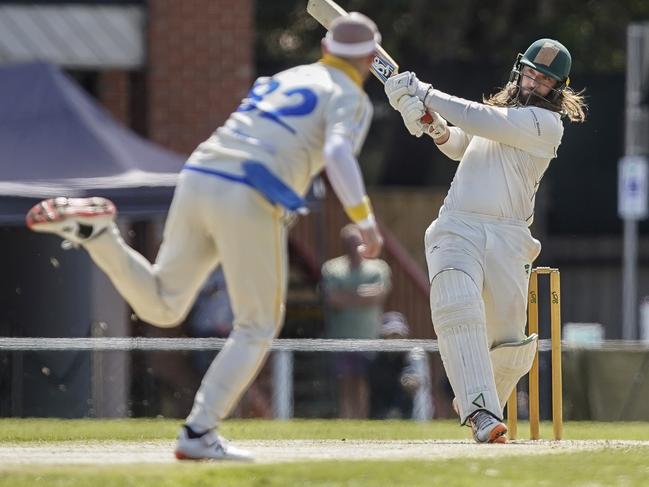 Caulfield batsman David Tantsis-Hall goes at Ormond paceman Rodney Bird. Picture: Valeriu Campan