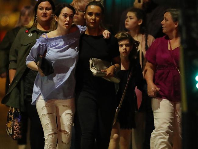 Police escort members of the public from the Manchester Arena.  Picture:  Getty