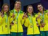 Gold medallists Australia's Mollie O'Callaghan, Australia's Emma McKeon, Australia's Chelsea Hodges and Australia's Kaylee McKeown pose during the medal presentation ceremony for the men's 4x100m medley relay swimming final at the Sandwell Aquatics Centre, on day six of the Commonwealth Games in Birmingham, central England, on August 3, 2022. (Photo by ANDY BUCHANAN / AFP)