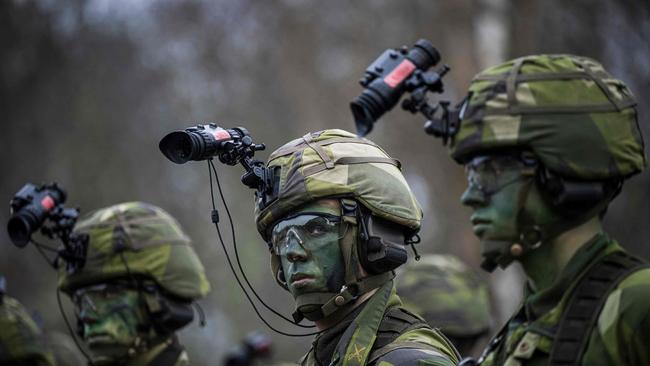 Soldiers from the 13th counter-intelligence battalion of the Swedish armed forces participate in a military exercise in Kungsangen, near Stockholm.