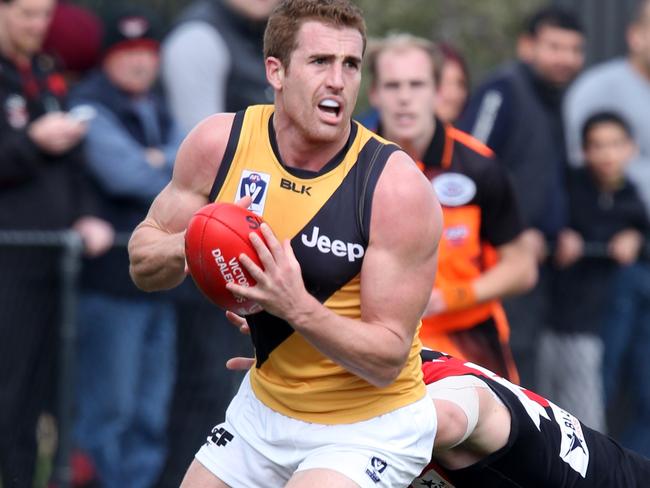 VFL: Essendon V Richmond at Craigieburn...Richmond 23 Daniel Jackson with ball leaves Essendon 43 Kurt Aylett behind