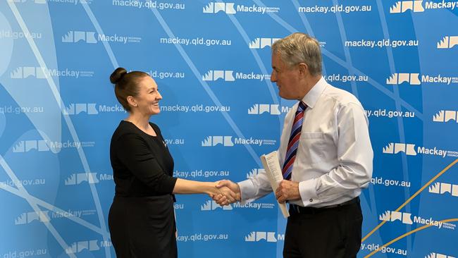 Acting CEO Angela Hays shakes hands with Mackay Mayor Greg Williamson. Mrs Hays will serve as acting CEO while Mr Thomson undergoes treatment for cancer. Picture: Duncan Evans