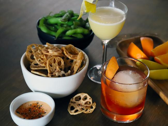 Tokyo Bird’s cocktails, edamame and lotus chips. Picture: Jenifer Jagielski