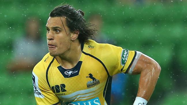 MELBOURNE, AUSTRALIA - FEBRUARY 28: Matt Toomua of the Brumbies passes the ball whilst being tackled during the round three Super Rugby match between the Rebels and the Brumbies at AAMI Park on February 28, 2015 in Melbourne, Australia. (Photo by Quinn Rooney/Getty Images)