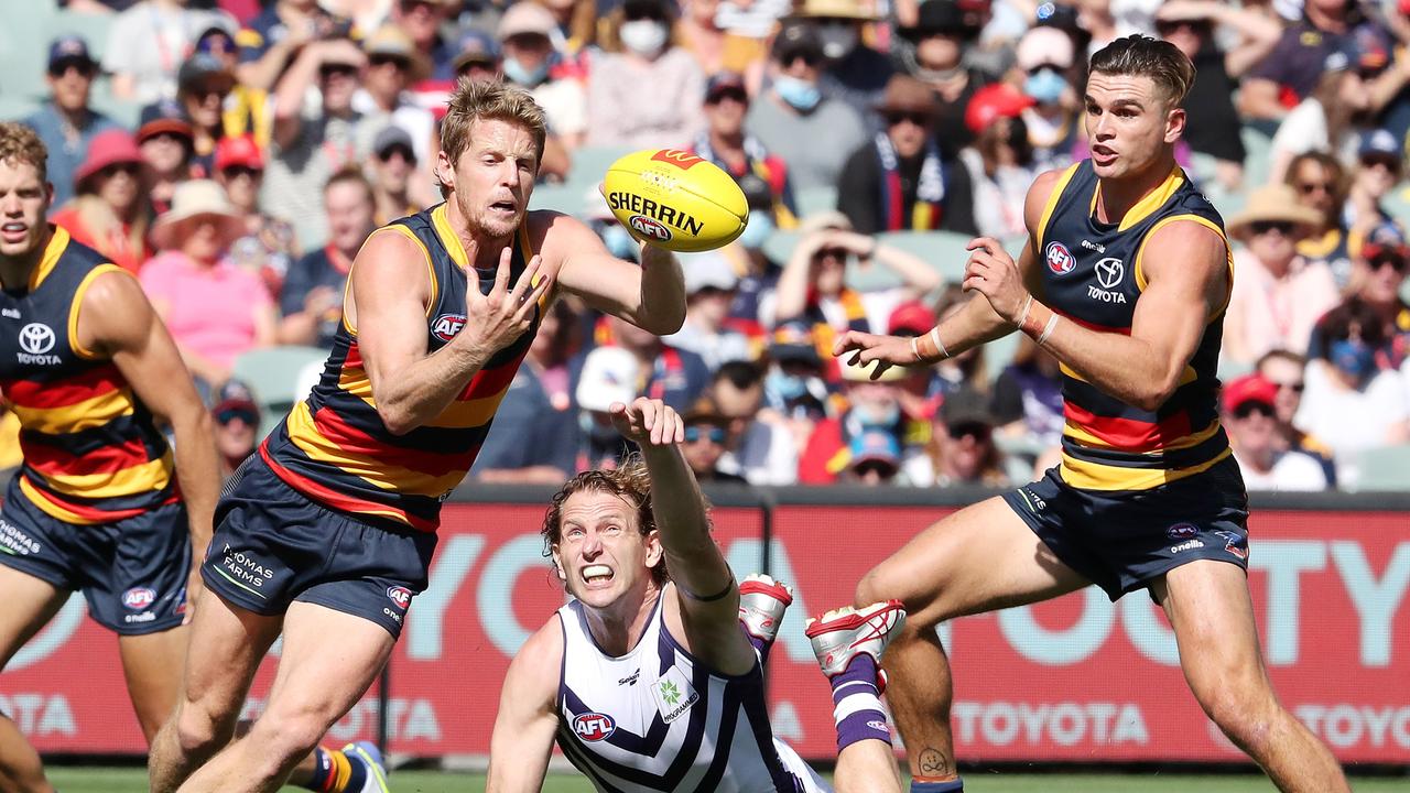 Rory Sloane eludes David Mundy at Adelaide Oval. Picture: AFL Photos via Getty Images