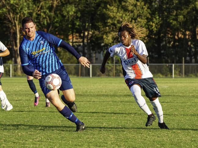 Nerang striker Joseph Fallembu (right), 15, in action against Tweed United on Saturday. Picture: Luke Sorensen