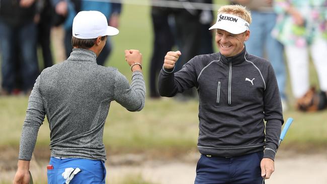 Soren Kjeldsen and Thorbjorn Olesen of Denmark celebrate a birdie.