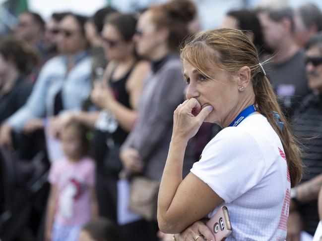 Shocked passengers gather for a solemn vigil at the Port of Tauranga. Picture: Brett Phibbs